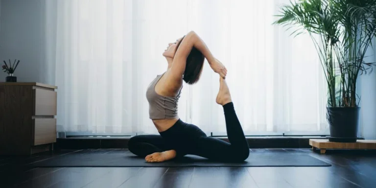 Woman practicing yoga at home