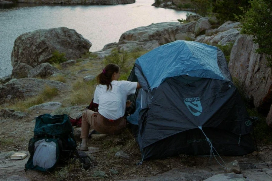 Woman setting up the tent