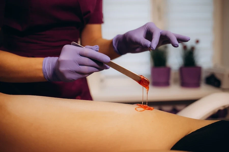 Woman waxing at a salon