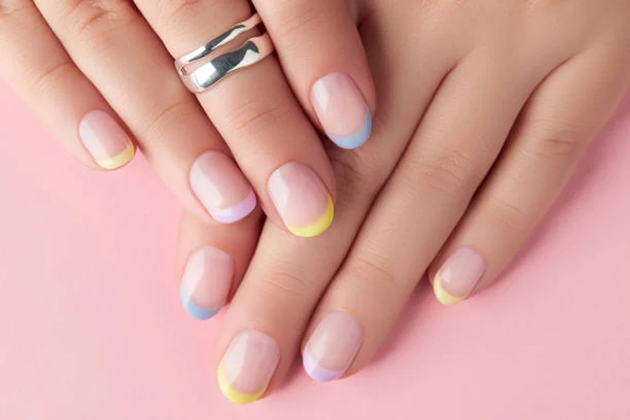 Woman with French pastel tips in different colors