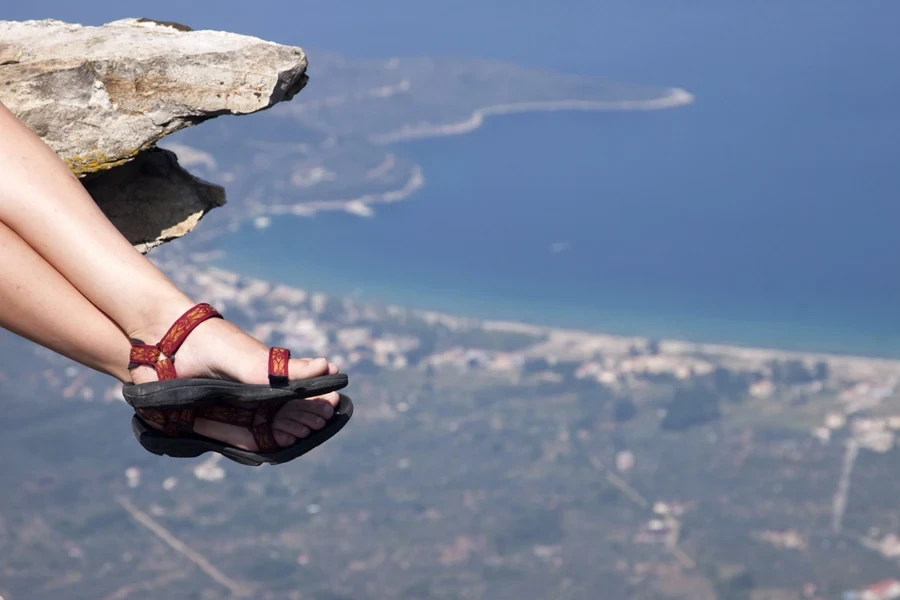 Woman with red and black trekking sandals