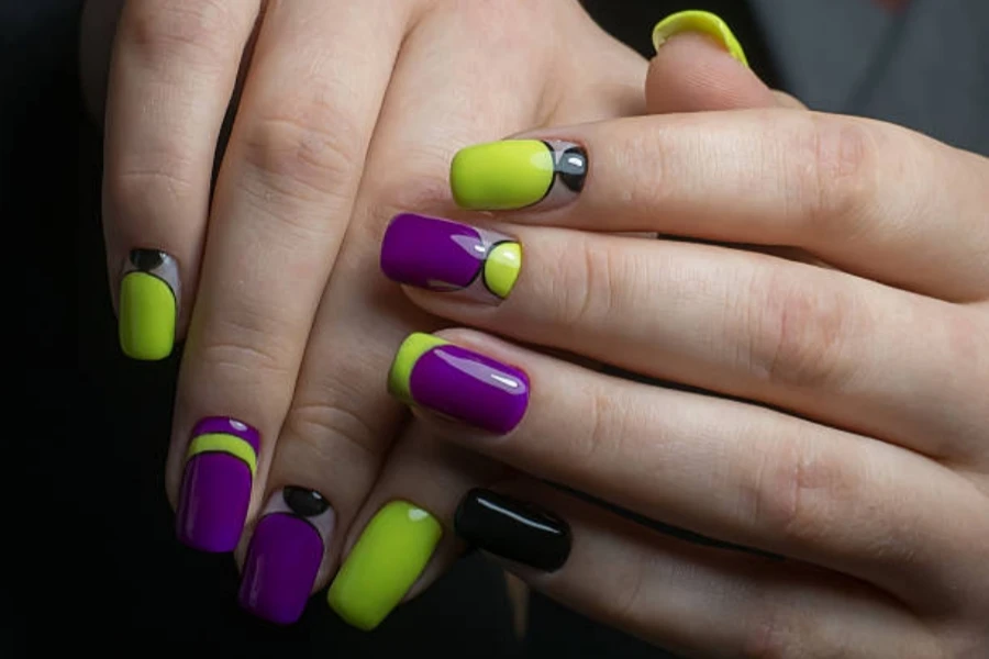 Woman with vibrant green nails that glow in the dark