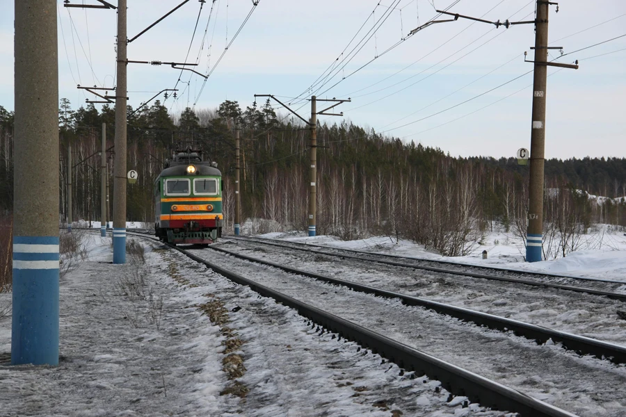 Yellow and Blue Train on Rail Tracks