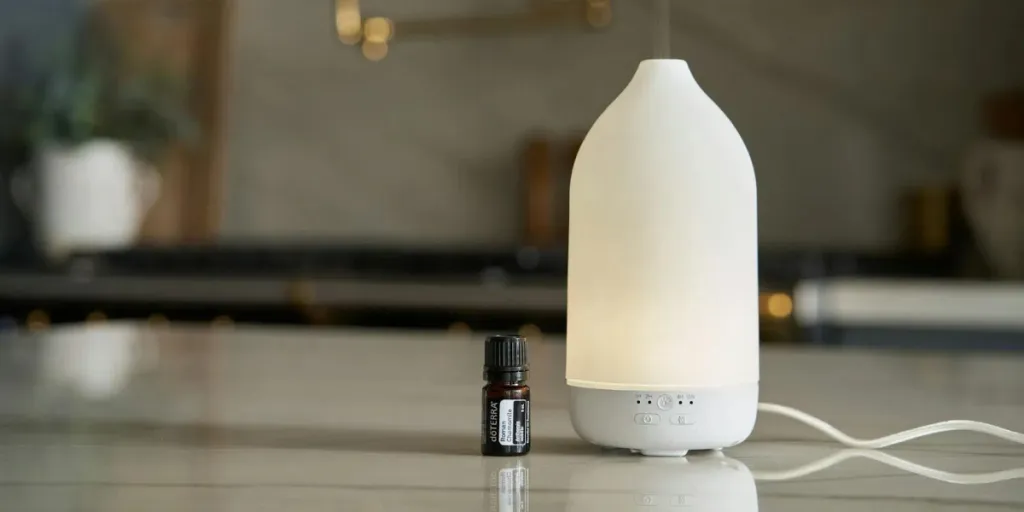 A bottle of essential oil and diffuser