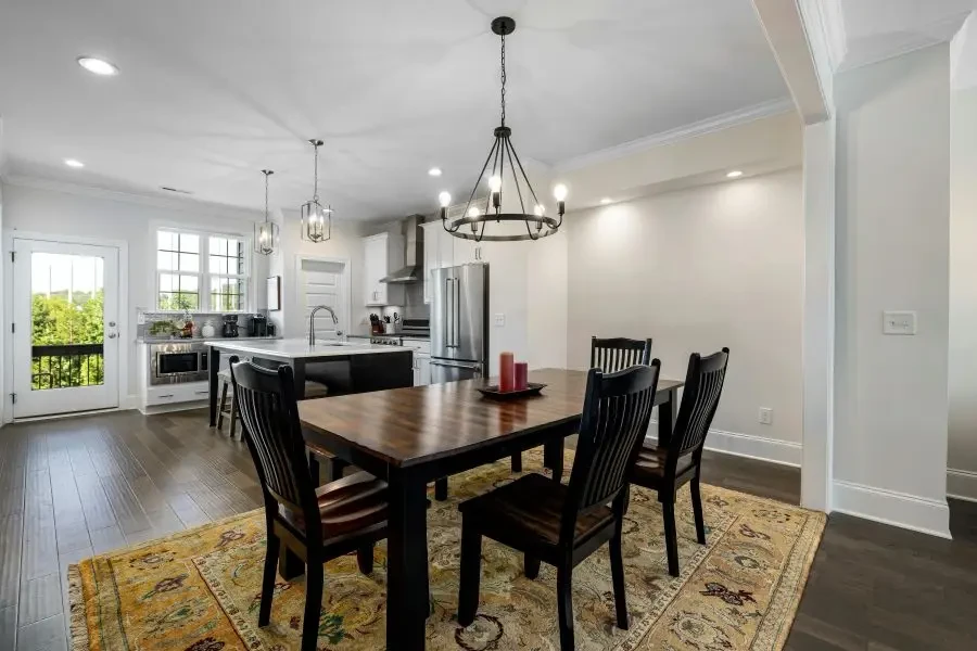 A kitchen rug under a dining table