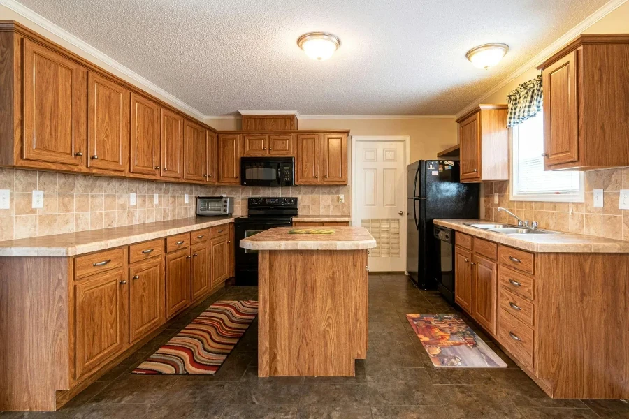 A kitchen with mats on both island sides