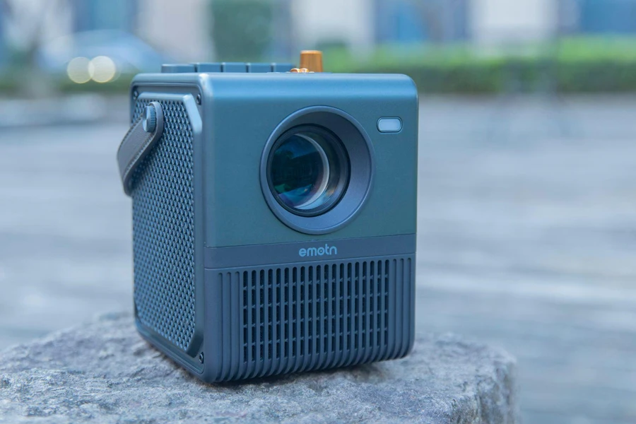 a small camera sitting on top of a rock