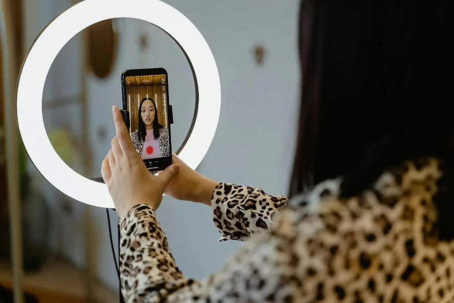 A woman creating a video to upload on social media