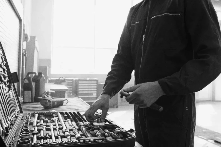 Man choosing a tool in a box