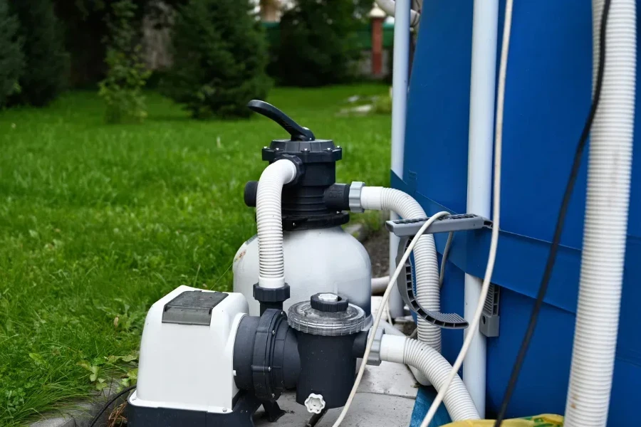 Sand filter system next to a pool