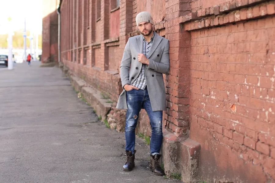 Stylish man in a fisherman beanie and gray coat