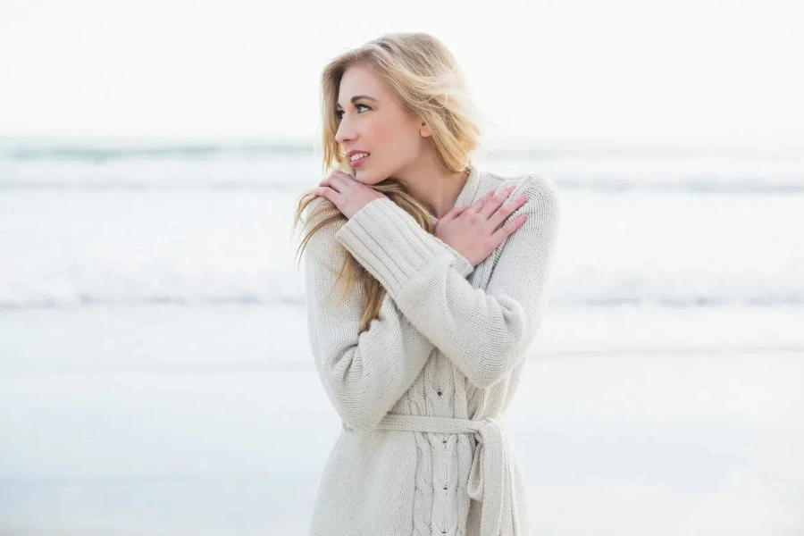 Stylish woman in a white cardigan