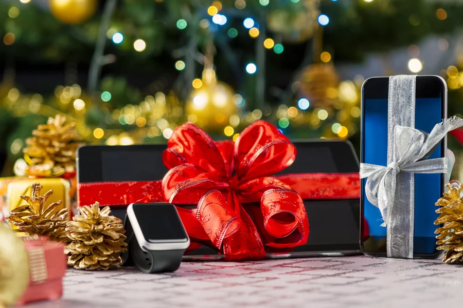 tablet, smartphone, and smartwatches together showing popular tech gifts