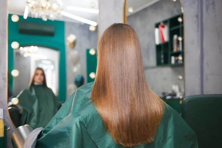 Woman checking out her hair botox treatment