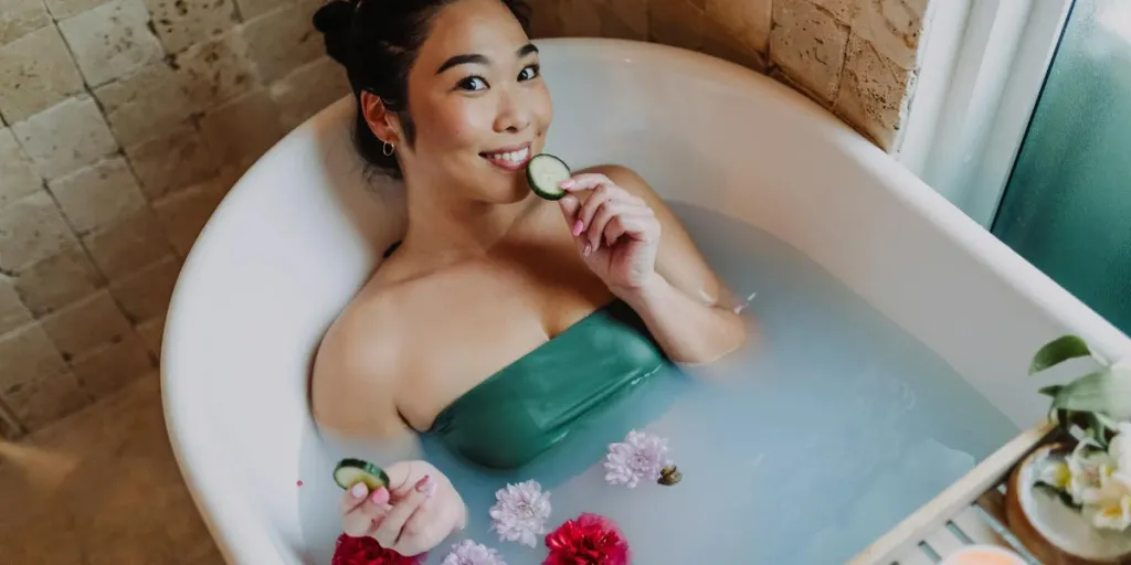 Woman pampering herself in a bathtub