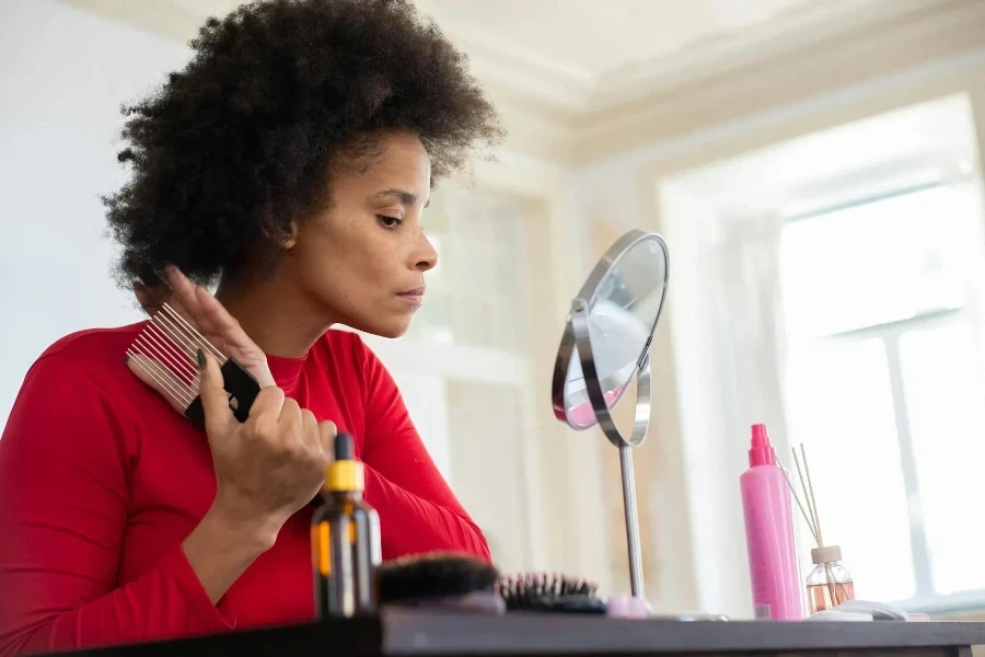 Woman taking care of her natural hair