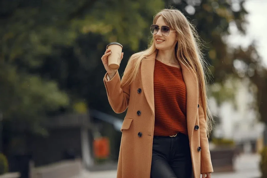 Woman wearing a double-breasted camel coat