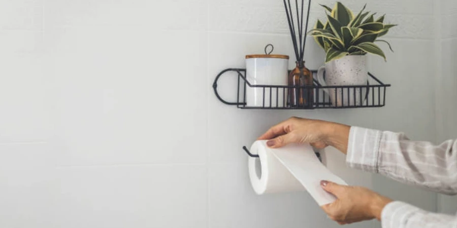 A Man's Hand Using White Toilet Paper