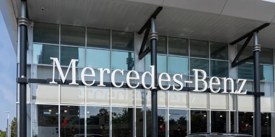 A Mercedes-Benz logo sign on the building