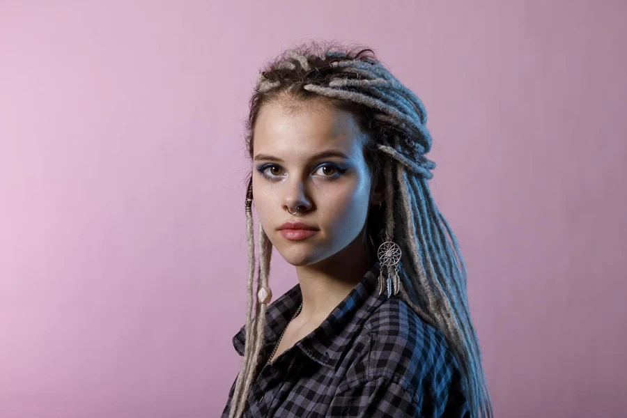 A Young Woman with Dreadlocks and Piercings