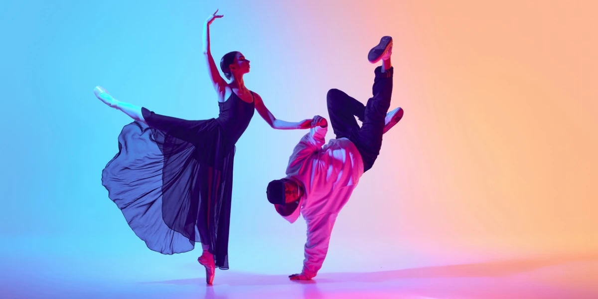 A ballerina and street dancer on stage