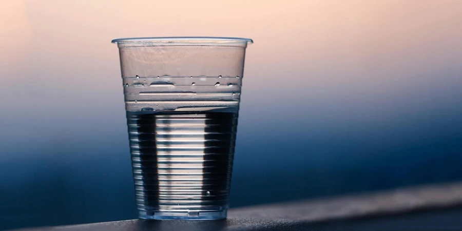 A clear plastic cup with water in it