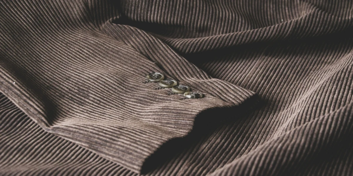 A close-up of a corduroy suit jacket