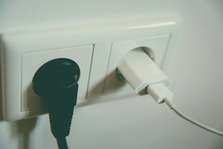 A close-up of a plug in a wall outlet