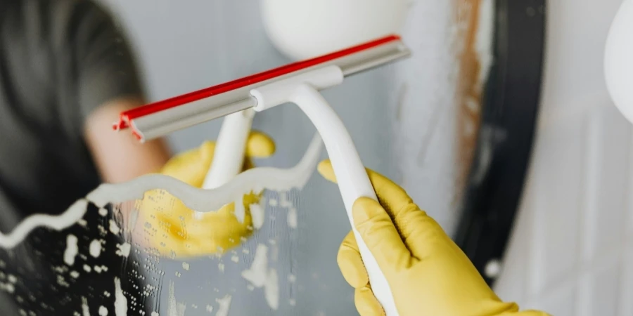 A person cleaning a window