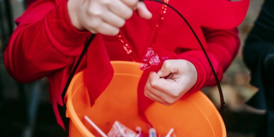 A person holding a string in a bucket