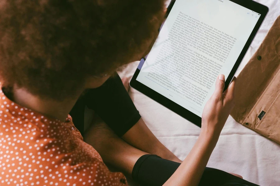 A person reading an e-book