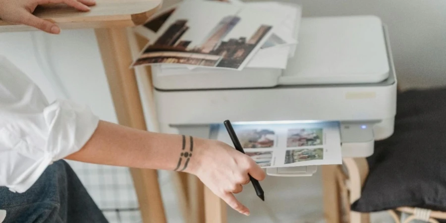 A person using a printer to print a photo