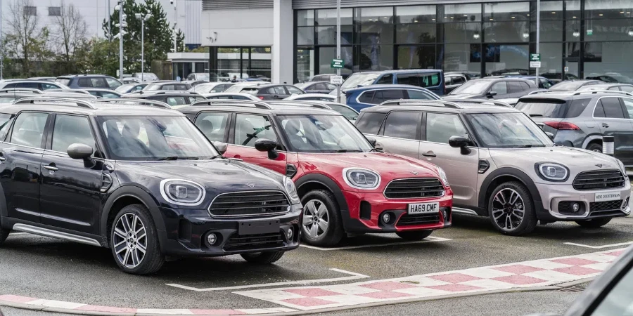 A row of Minis in showroom parking lot