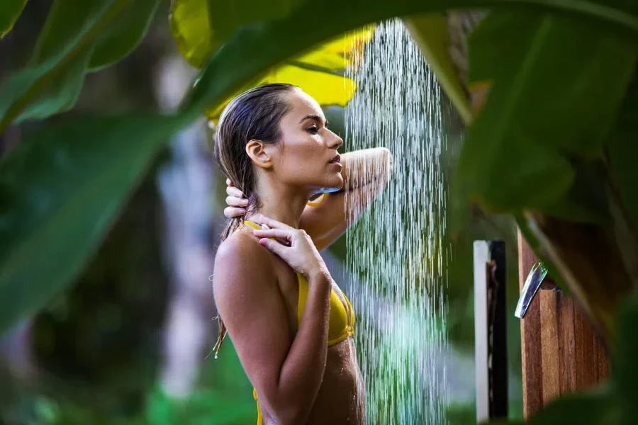 A woman using outdoor shower