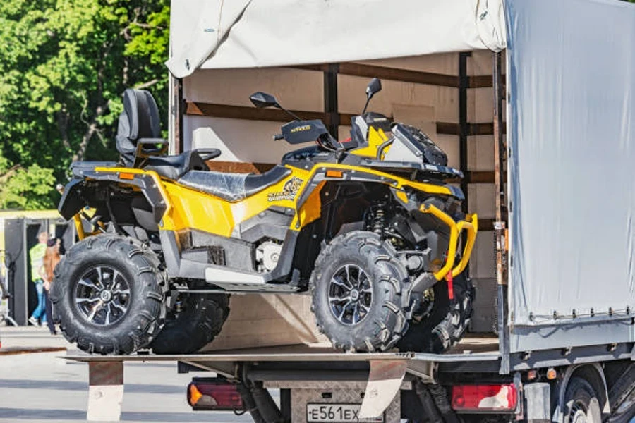 ATV Quad Bike at loading process to the freight truck.