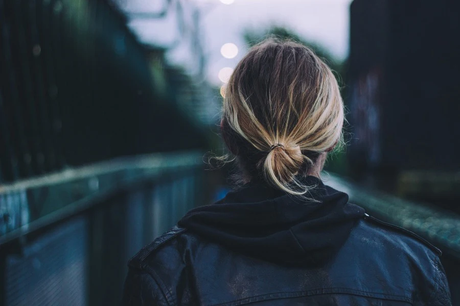 Back view of brown and blonde hair tied in a bun