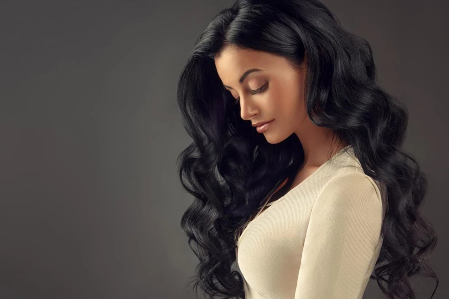 Black Haired Woman with Voluminous, Shiny and Curly Hairstyle