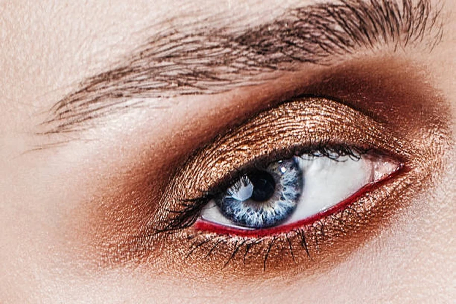 Blue eye with rose gold metallic eyeshadow makeup