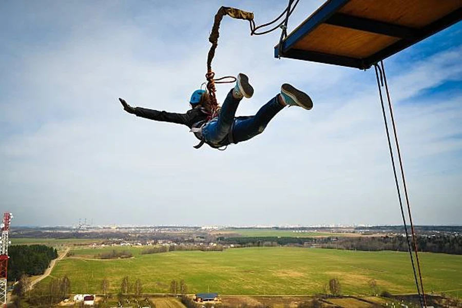 Bungee jumping site above large field on clear day