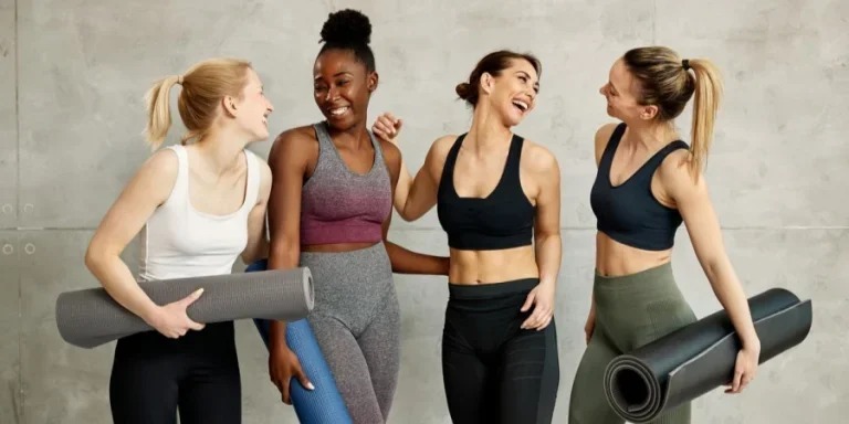 Cheerful Multi-Ethnic Group of Athletic Women Having Fun Together