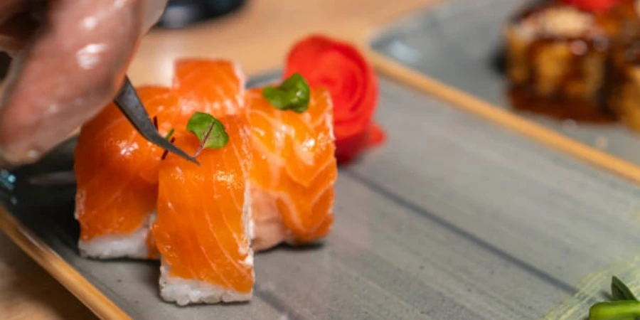 Chef Uses Tweezers to Place Leaves of Greenery on Philadelphia Sushi