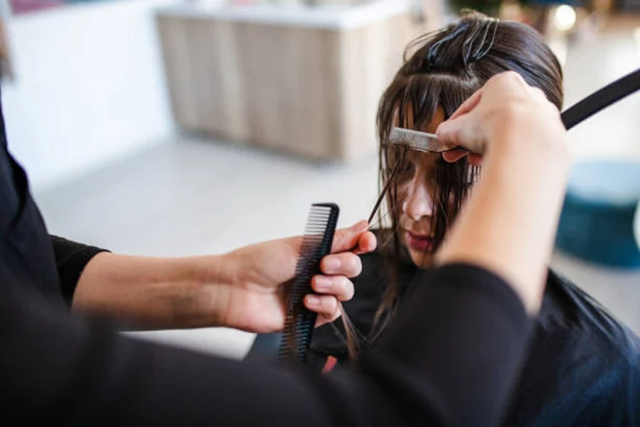 Client Having Bangs Trimmed During Haircut