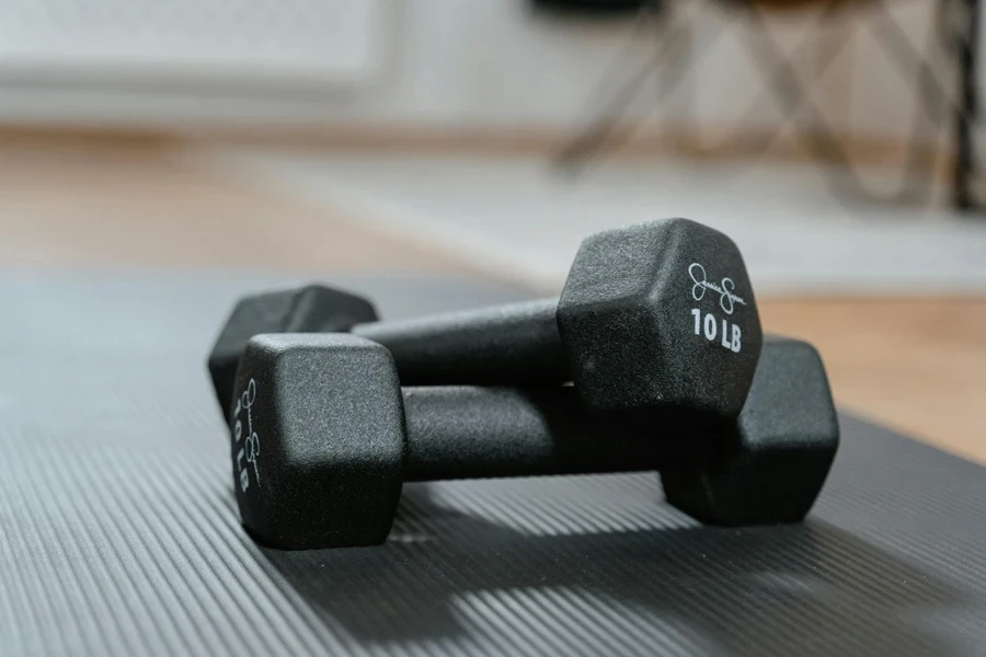 Close Up Photo of Black Dumbbells