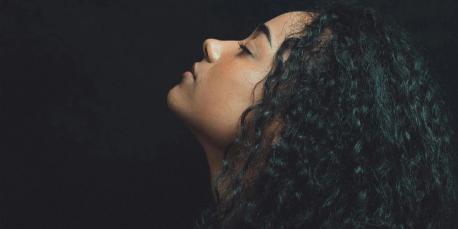 Close-Up Photo of Woman With Curly Hair