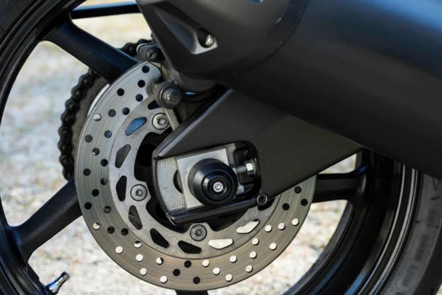 Close-up of a rear wheel ventilated disk brake of a naked bike