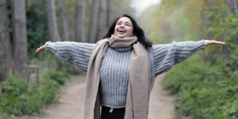 Girl Wearing a Scarf and a Knitted Grey Sweater