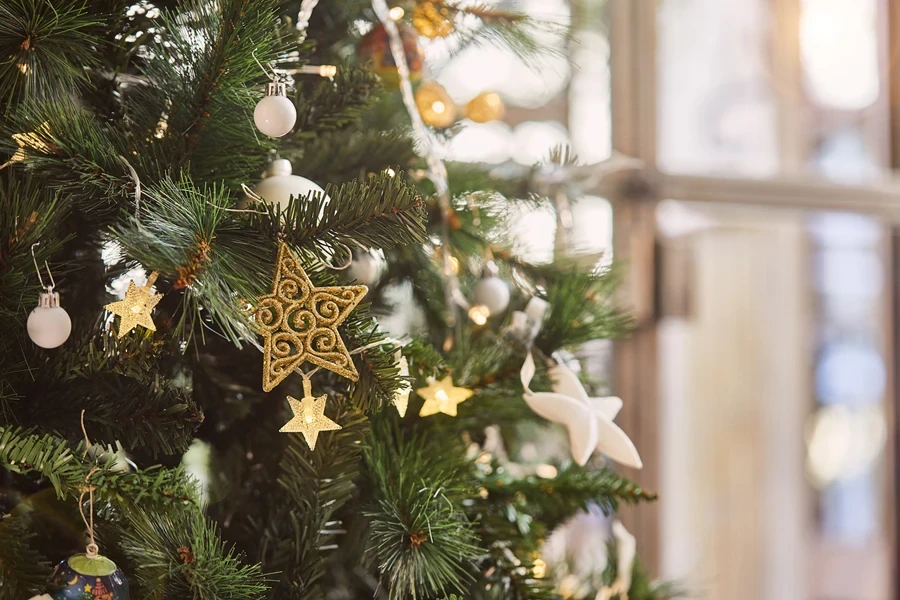 Gold stars and white balls on a Christmas tree