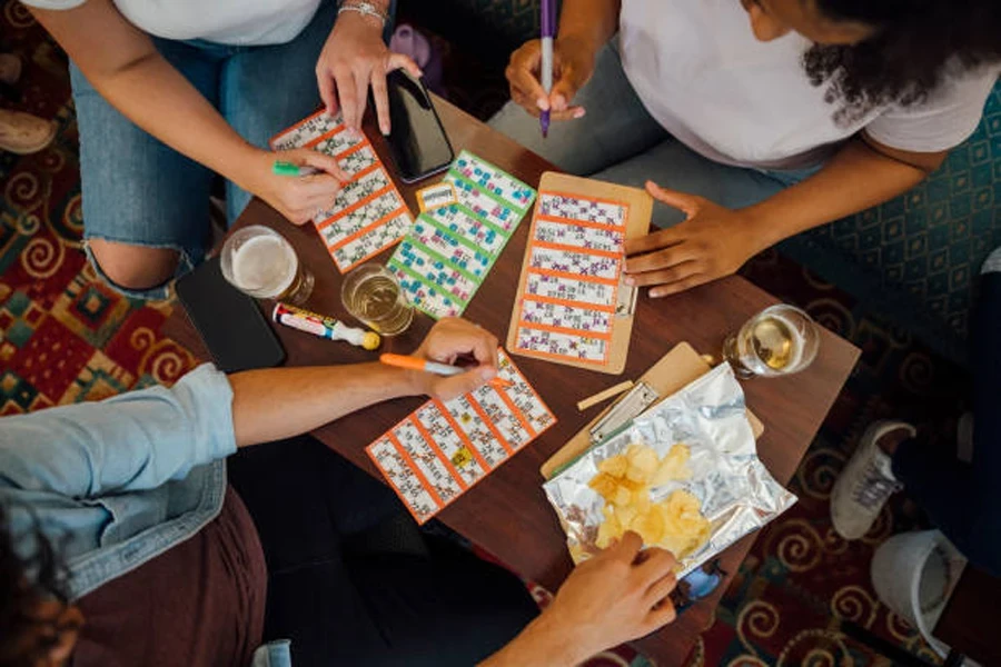 Group of friends at table playing speed bingo