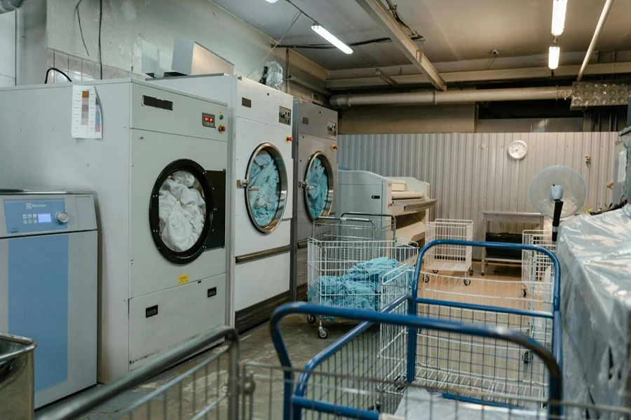 High-capacity washing machines and dryers in a laundry room