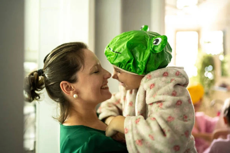 Mother and Daughter Embracing After Bath at Home